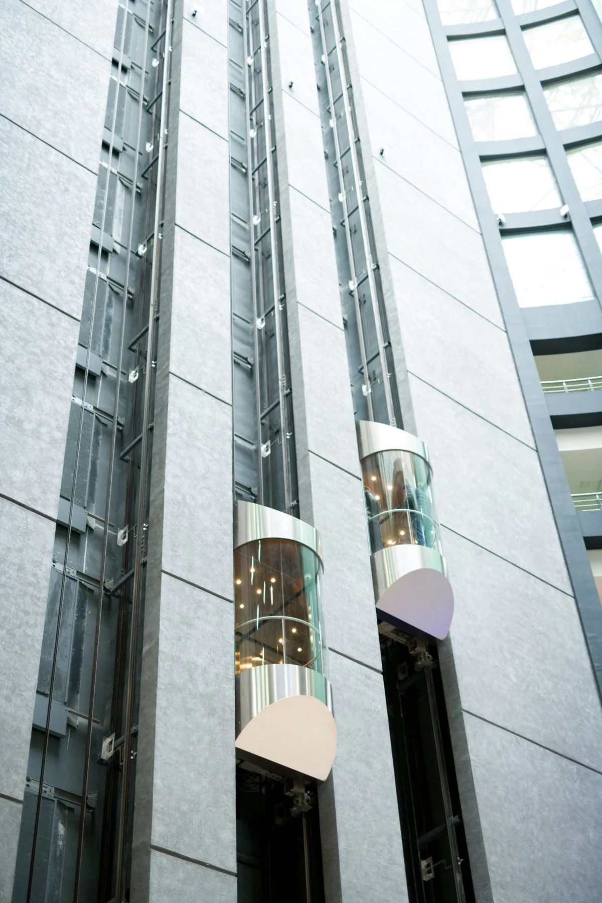 Panoramic glass lifts in a commercial atrium